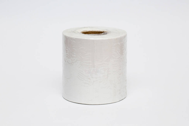Roll of cash register tape isolated on soft gray background.High resolution photo. - Photo, Image