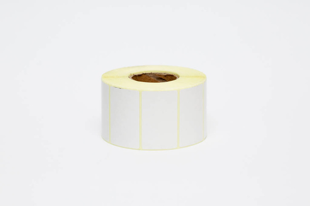 Roll of cash register tape isolated on soft gray background.High resolution photo. - Photo, Image
