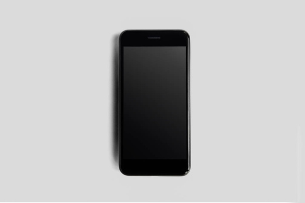 Smartphone lágy szürke háttér. Modell telefon-val üres képernyő. 3D-leképezés. - Fotó, kép