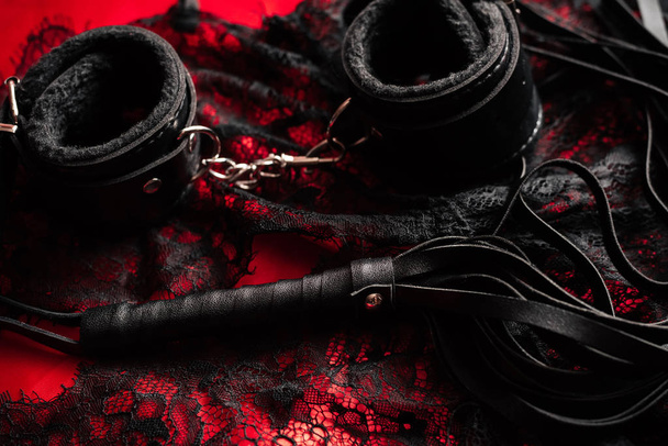 whip and handcuffs with lace underwear for BDSM sex - Fotoğraf, Görsel