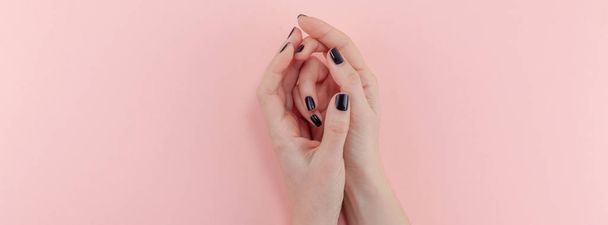 Woman's hands with black manicure - Photo, Image