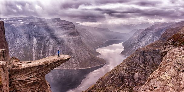 Hiker in mountains, Trolltunga , Norway - Фото, изображение