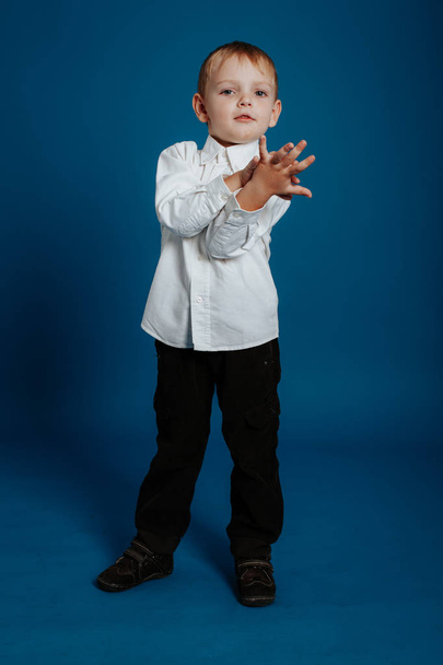Little boy in a white shirt. Small child. - Фото, зображення