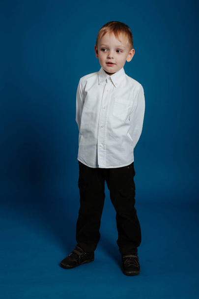 Little boy in a white shirt. Small child. - Foto, afbeelding