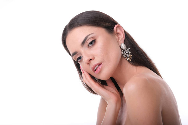 Young, elegant woman with glamour make up and rich earrings. - Photo, Image