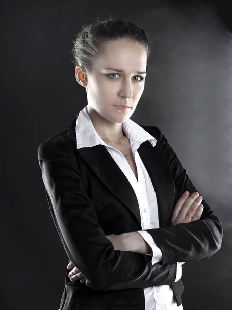 portrait of serious business woman .isolated on black background - Zdjęcie, obraz