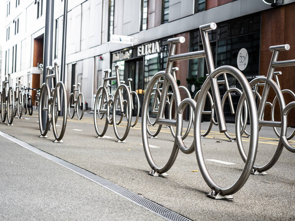 Outdoor Sculptures in Oslo Norway Bicycle Parking Yard Monument Background, The Bike Racks at Barcode Project in Oslo, Norway, 2 April 2018 - Foto, afbeelding