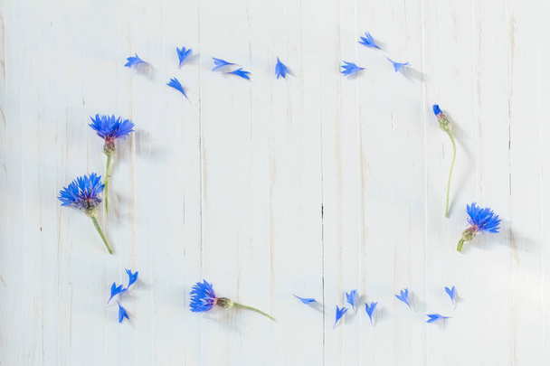 cornflowers on white wooden background - Fotoğraf, Görsel