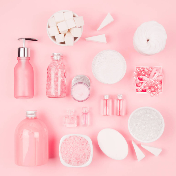 Modern exquisite set of cosmetic products and accessories in pastel pink color, copy space, flat lay, square. - Photo, Image