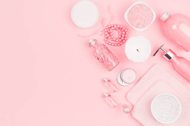 Different cosmetic products and accessories in pink and silver color on soft light pink background, copy space, top view. - Fotoğraf, Görsel