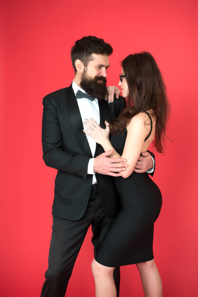 Elegance is not about being noticed. Award ceremony concept. Bearded man wear suit girl elegant dress. Formal dress code. Visiting event or ceremony. Couple ready for award ceremony. Corporate party - 写真・画像