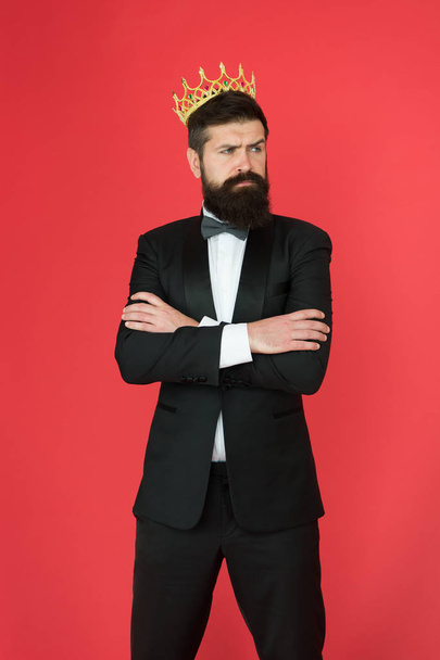 Self confidence concept. Handsome hipster formal suit. Feeling superior. Man bearded handsome guy in formal suit golden crown symbol of monarchy. King on this event. King attribute. Narcissistic king - Photo, Image