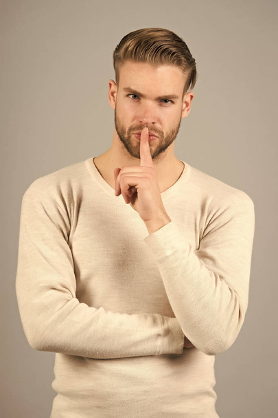Keep silence. Man handsome attractive silence gesture. You better keep our secret. Being entrusted with secret can be both delight and burden. Guy asks to keep his secret - Foto, Bild