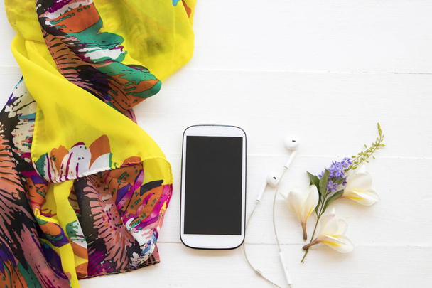 yellow scarf ,mobile phone  of lifestyle woman relax summer and flower frangipani decoration on background white - Foto, immagini