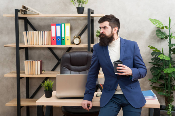 Relaxed top manager drinking coffee. Man bearded manager businessman entrepreneur hold cup of coffee. Boss enjoying energy drink. Worker start day with hot coffee. Benefits of office coffee culture - 写真・画像
