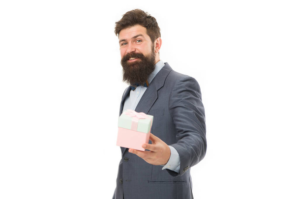 Nice present. Gift for spouse. Romantic surprise. Man formal suit hold gift box white background. Love and romantic feelings concept. Valentines day gift. Man with beard celebrate valentines day - Photo, image
