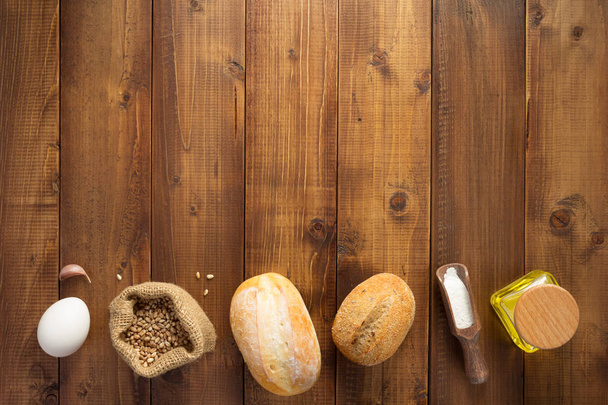 bakery ingredients on wooden background  - Zdjęcie, obraz