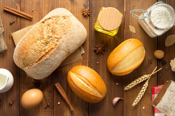 bread and bakery ingredients on wood - Fotó, kép