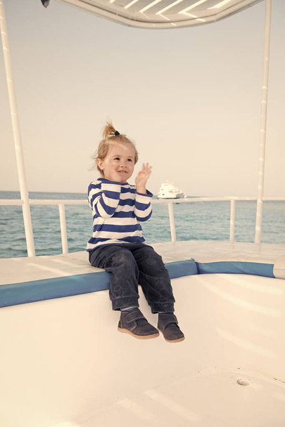 Best cruises for kids. Kid boy toddler travelling sea cruise. Child in striped shirt looks like young sailor. Child enjoy vacation on cruise ship. Family vacation on cruise ship all inclusive tour - 写真・画像
