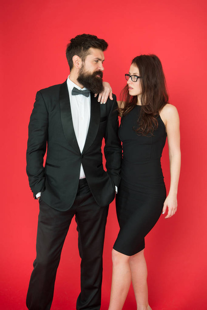 Formal dress code. Visiting event or ceremony. Couple ready for award ceremony. Main rules picking clothes. Corporate party. Award ceremony concept. Bearded gentleman wear tuxedo girl elegant dress - Photo, Image