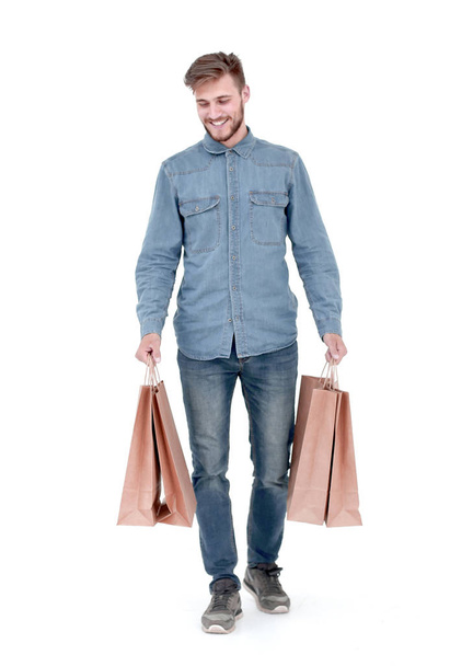 a young guy with brown paper bags in his hands. - Photo, image