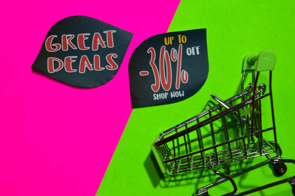 Great Deals Up To 30% Off Shop Now Text and Shopping cart. Discount and promotion business concept on colorful background - Фото, изображение