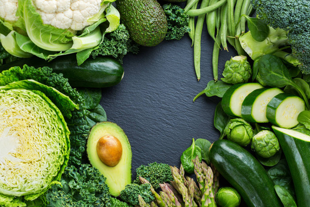 Assortment of organic green vegetables, clean eating vegan concept - Фото, изображение