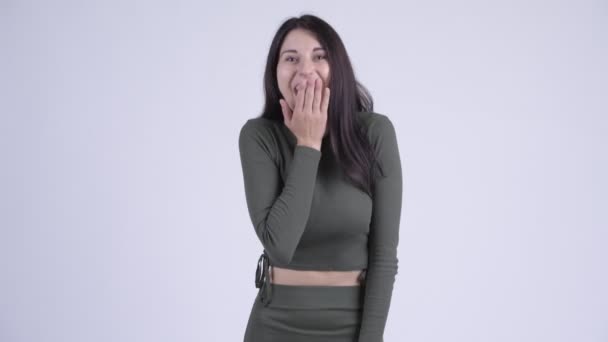 Happy young beautiful woman looking surprised - Footage, Video