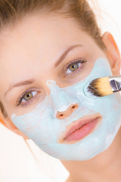 Girl apply green mud mask to face - Photo, Image