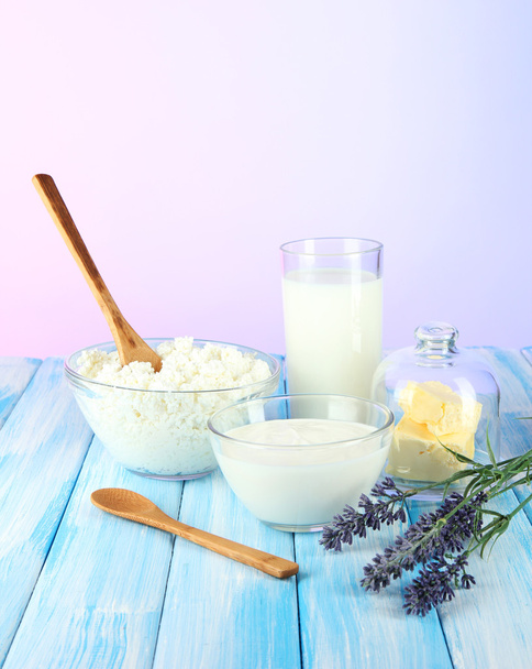 Glass of milk and cheese on light background - Photo, Image