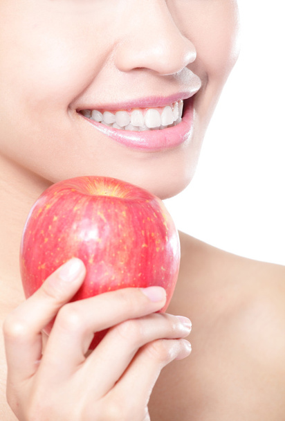 young woman eating red apple with health teeth - Foto, imagen