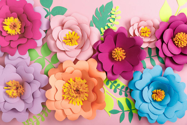 top view of paper colorful flowers and leaves on pink background  - Foto, immagini