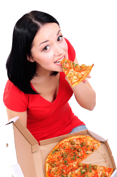 Beautiful girl eats pizza isolated on white - Photo, image