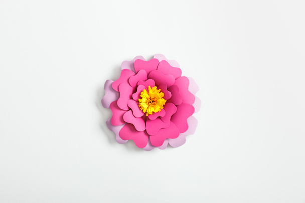 top view of pink and lilac paper flower on grey background - Photo, Image