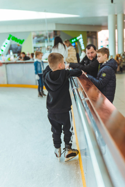 LVIV, UKRAINE - February 3, 2019: people skating on ski rink in city mall - Photo, image