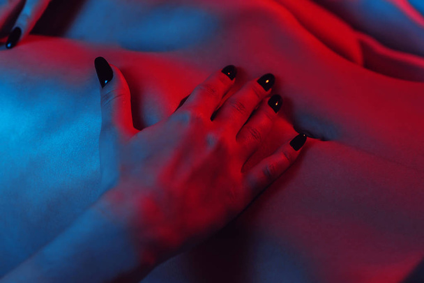 woman hand on a slender tummy close-up - Foto, Imagem