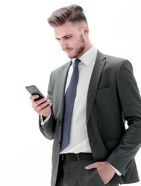 serious businessman reading text message on smartphone - 写真・画像