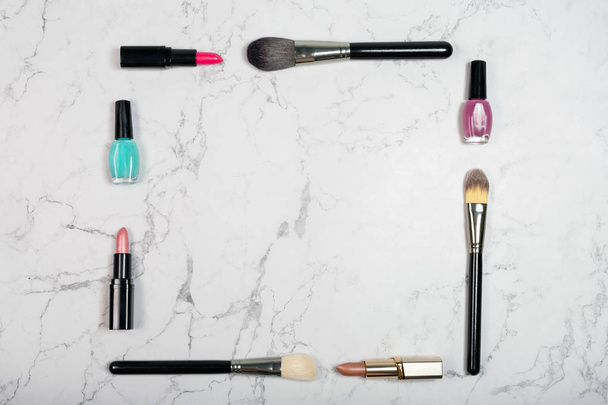 Flat lay of cosmetic products on white marble background - Foto, afbeelding