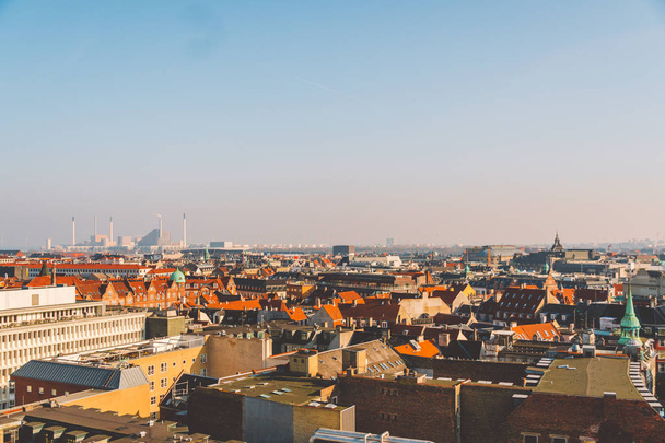 February 18, 2019. Denmark Copenhagen. Panoramic top view of the city center from a high point. Round Rundetaarn Tower - Photo, Image
