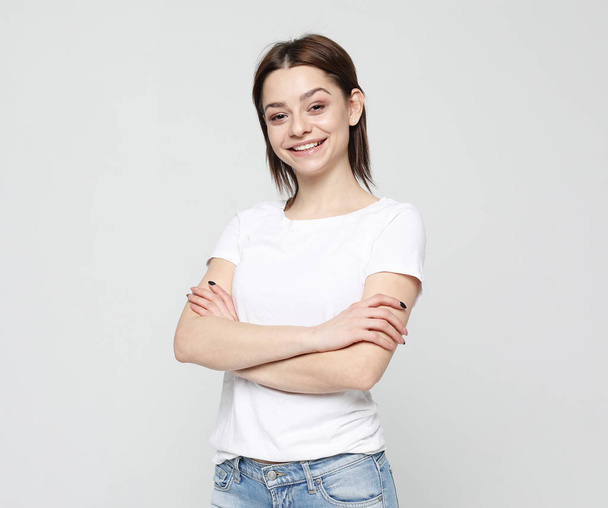 Portrait of young positive female with cheerful expression - Foto, immagini