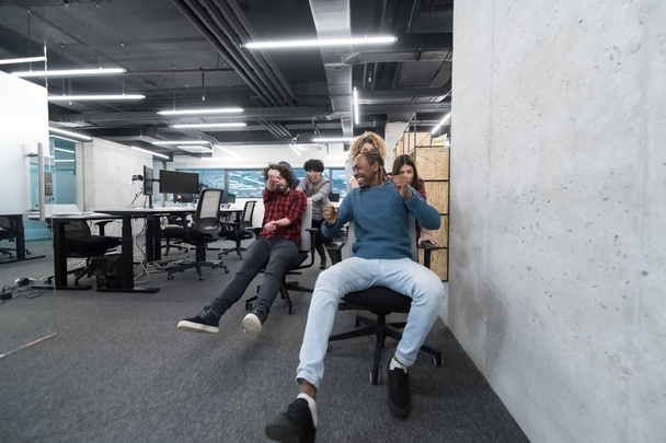 multiethnics business team racing on office chairs - Valokuva, kuva