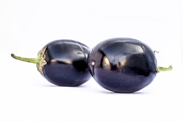 Close up of fresh organic egg plant or bringal or Aubergines or brinjal or baingan or eggplant isolated on white. - Fotoğraf, Görsel
