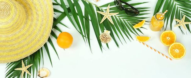 palm green leaves, fresh oranges and orange juice on white background - Photo, image