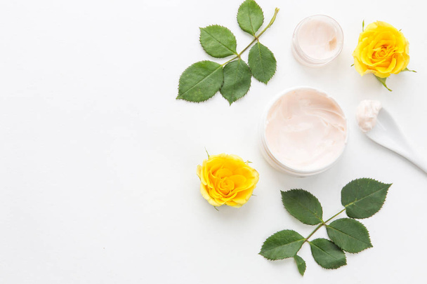 good morning. spring branch of rose flowers, makeup brushes and cream, face care, spa on white background - Foto, immagini