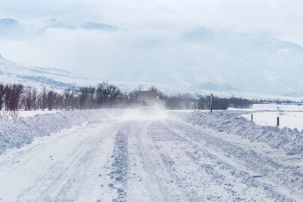 Road in the snow in the foothills - 写真・画像