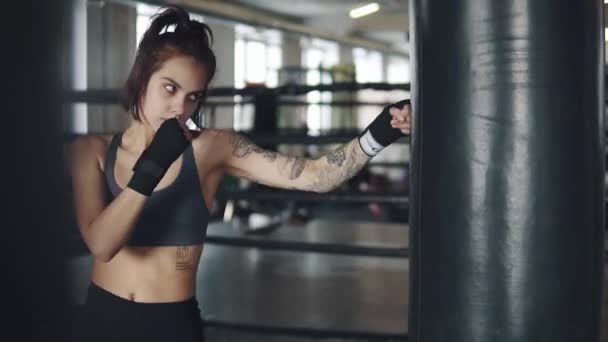 female boxer with wrapped hands fight training process - Footage, Video
