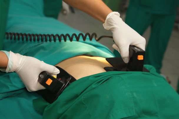 Defibrillator practice on a CPR - Fotoğraf, Görsel