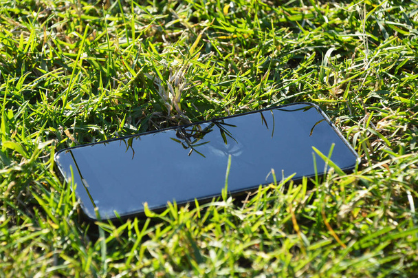 Smart phone on grass - Photo, image