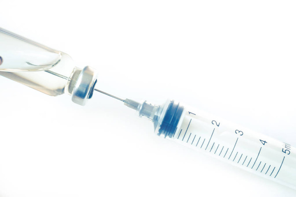 Medical glass vials and syringe for vaccination. Medical concept - Photo, Image
