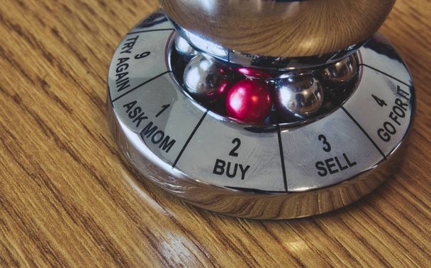 Metal decision maker with 'Buy' selected from the wheel of options - Photo, Image